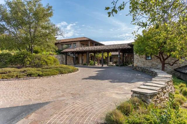 a view of a patio with a table chairs and a table