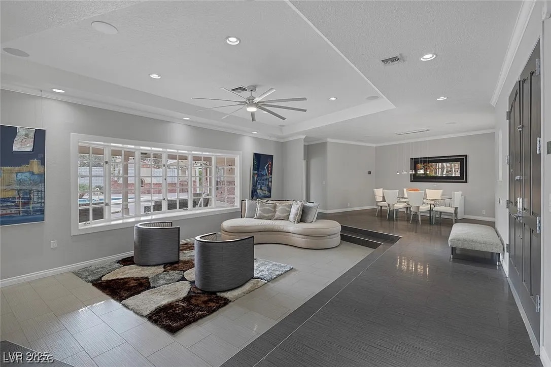 9 Quail Run Road Henderson, NV 89014 - Photo 7 of 57 A spacious, open concept living area showcases varied flooring and generous window light.