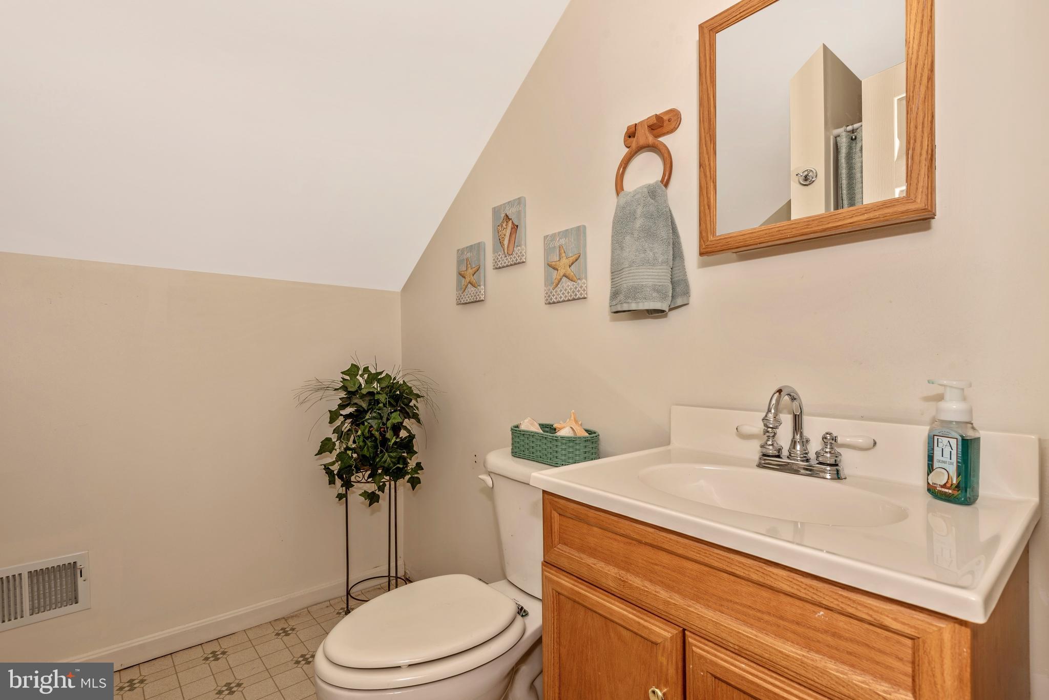 3522 Hooper Road New Windsor, MD 21776 - Photo 30 of 43 a bathroom with a sink a toilet and mirror