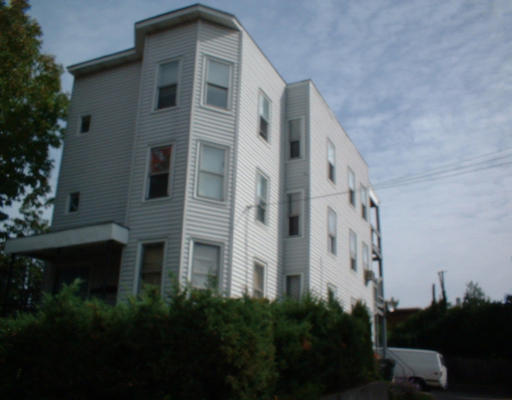 57-63 Lyons Street Springfield, MA 01151 - Photo 1 of 2 a front view of a building with plants