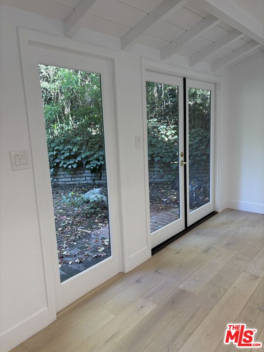 643 Hightree Road Santa Monica, CA 90402 - Photo 16 of 25 a view of a floor to ceiling window and wooden floor