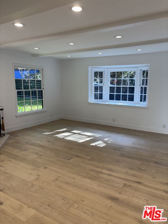 643 Hightree Road Santa Monica, CA 90402 - Photo 18 of 25 a view of empty room with wooden floor and fan