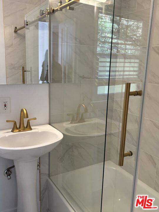 643 Hightree Road Santa Monica, CA 90402 - Photo 19 of 25 a bathroom with a sink and shower