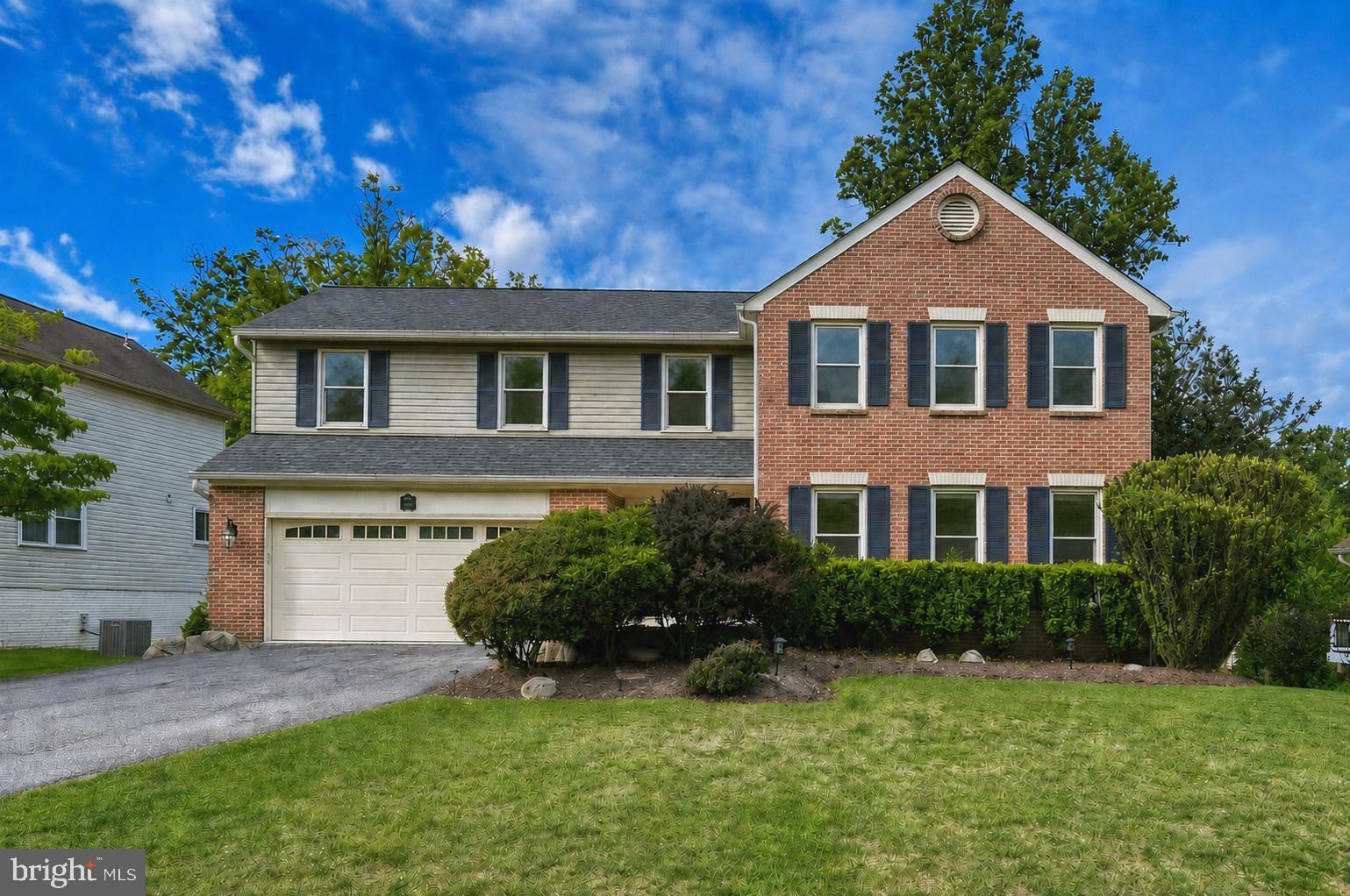 2108 Merrifields Drive Silver Spring, MD 20906 - Photo 3 of 69 a front view of a house with a yard