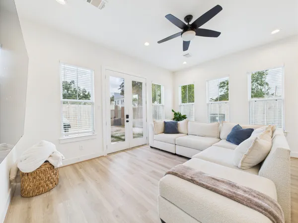 a living room with furniture and a large window