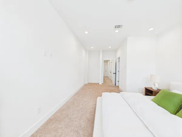 a bedroom with a bed and a cabinets