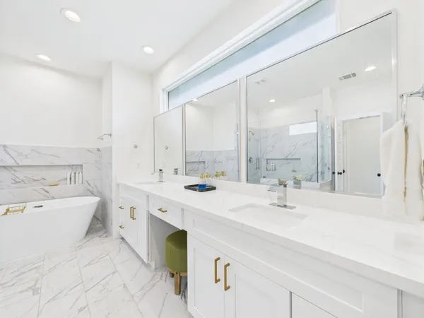 a spacious bathroom with a double vanity sink mirror double and bathtub