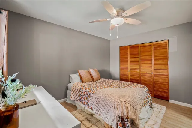 a bedroom with a large bed and a window