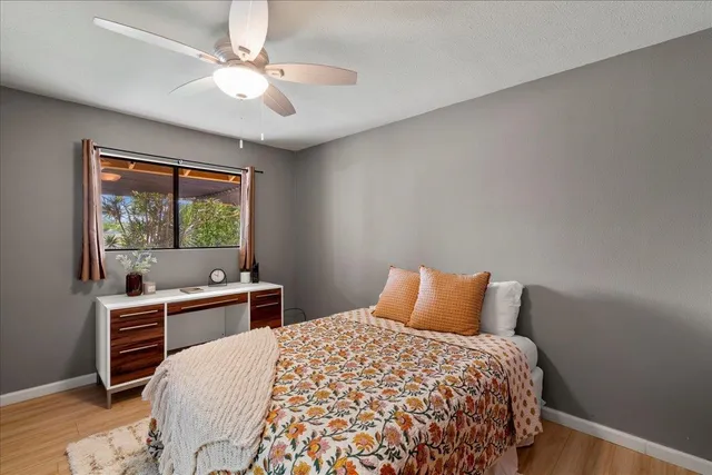 a bathroom with a granite countertop sink a mirror and a shower
