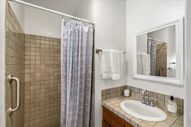 a bathroom with a toilet and shower