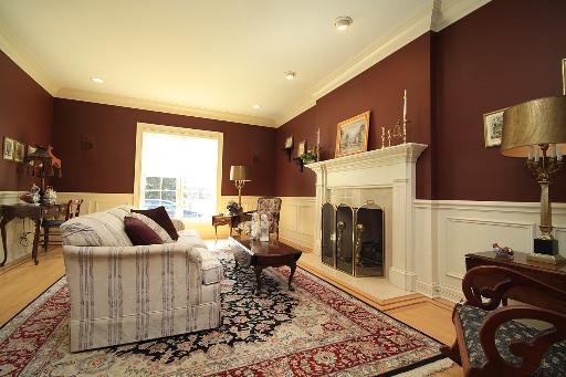36W466 Lancaster Road St. Charles, IL 60175 - Photo 2 of 16 a living room with furniture and a fireplace
