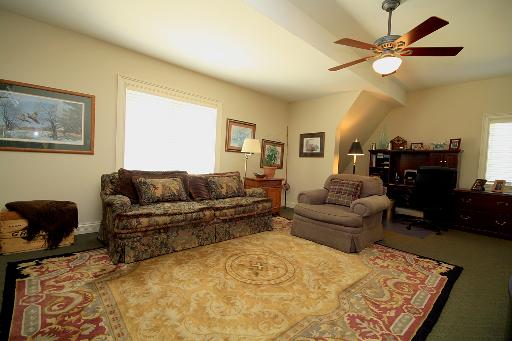 36W466 Lancaster Road St. Charles, IL 60175 - Photo 11 of 16 a living room with furniture and a rug