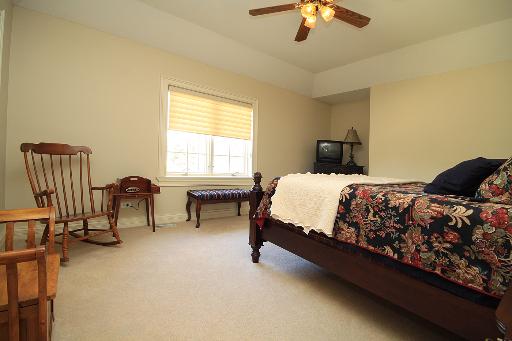 36W466 Lancaster Road St. Charles, IL 60175 - Photo 12 of 16 a bedroom with a bed chair and a chandelier