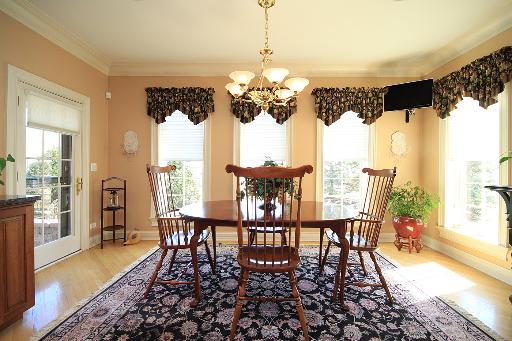 36W466 Lancaster Road St. Charles, IL 60175 - Photo 6 of 16 a dining room with furniture a chandelier and wooden floor