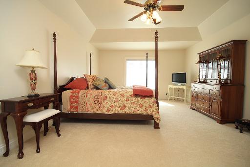 36W466 Lancaster Road St. Charles, IL 60175 - Photo 10 of 16 a bedroom with a bed dresser and a chandelier