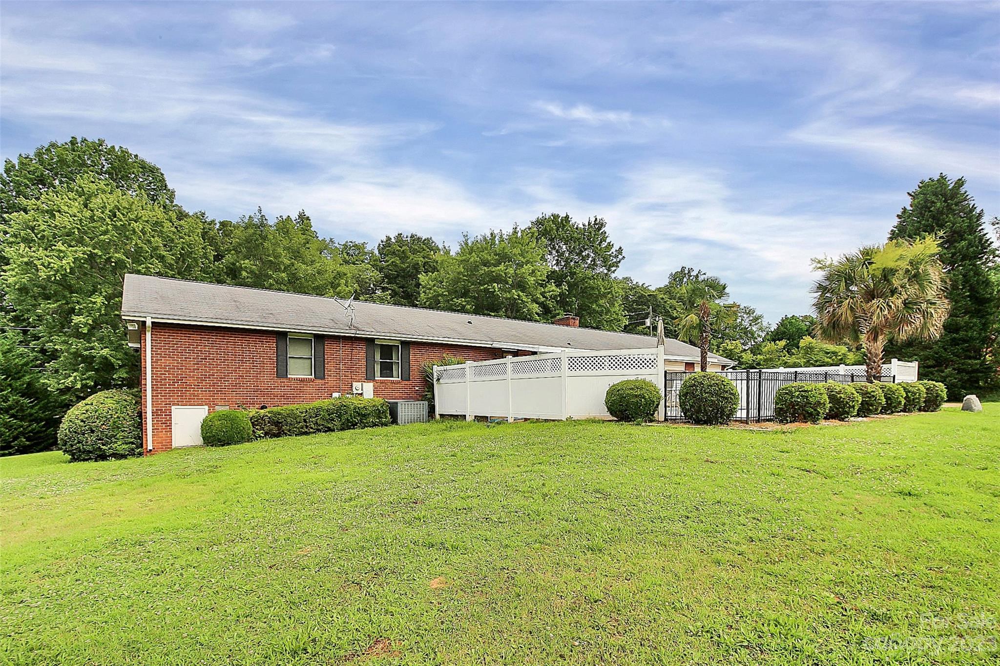 870 Bridle Path Fort Mill, SC 29708 - Photo 34 of 34 a view of a house with a yard and large trees
