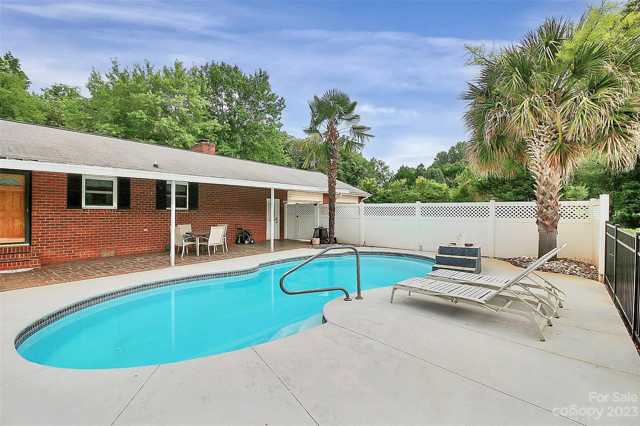 870 Bridle Path Fort Mill, SC 29708 - Photo 8 of 34 a view of a house with swimming pool and sitting area