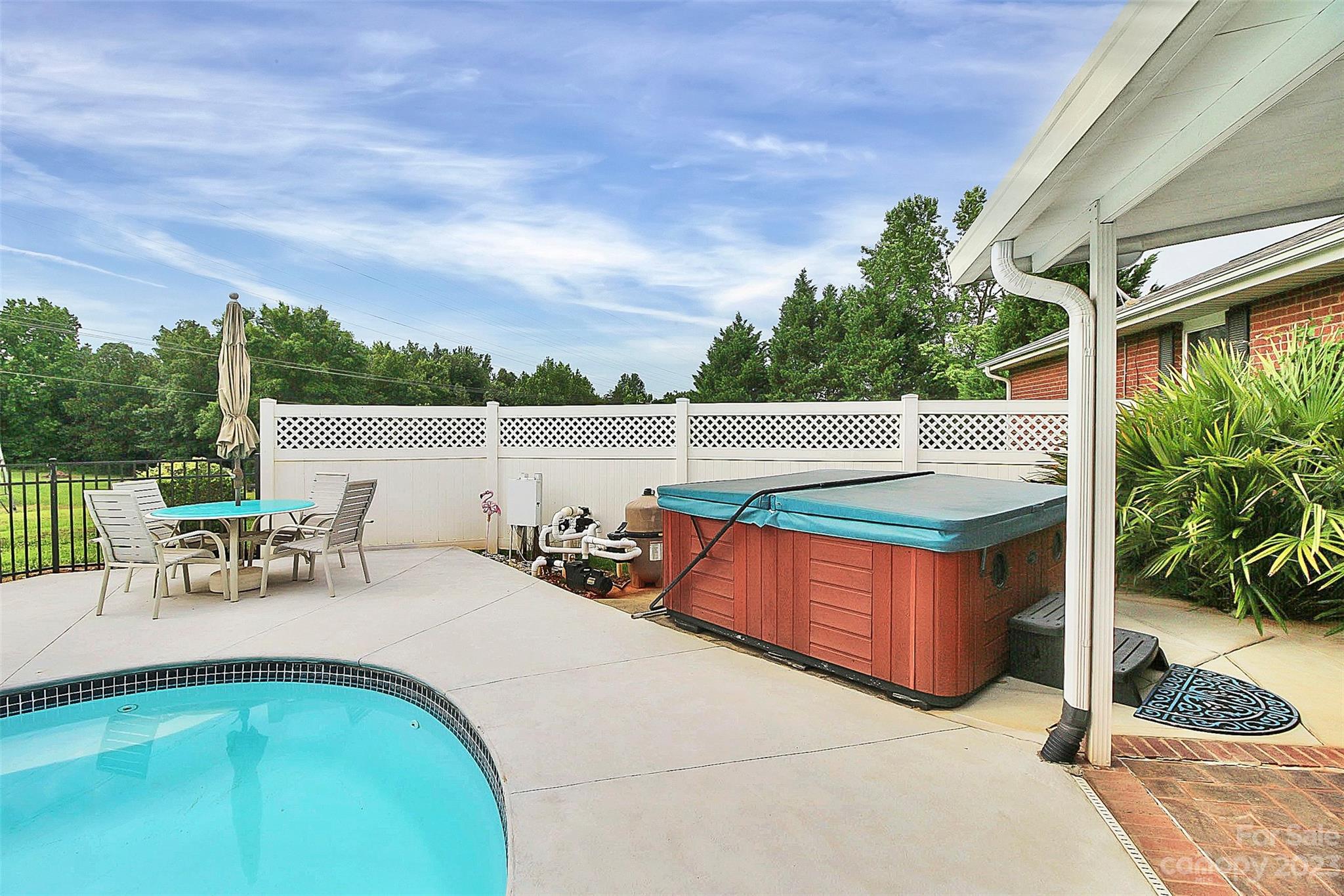 870 Bridle Path Fort Mill, SC 29708 - Photo 10 of 34 a view of swimming pool with outdoor seating and plants