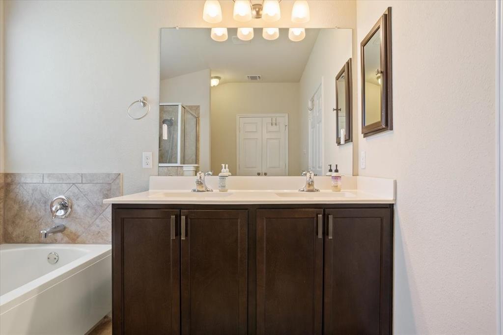5308 Tama Drive Waco, TX 76708 - Photo 17 of 29 a bathroom with a sink and a mirror