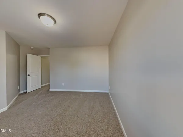 a bathroom with a sink a light fixture and a mirror