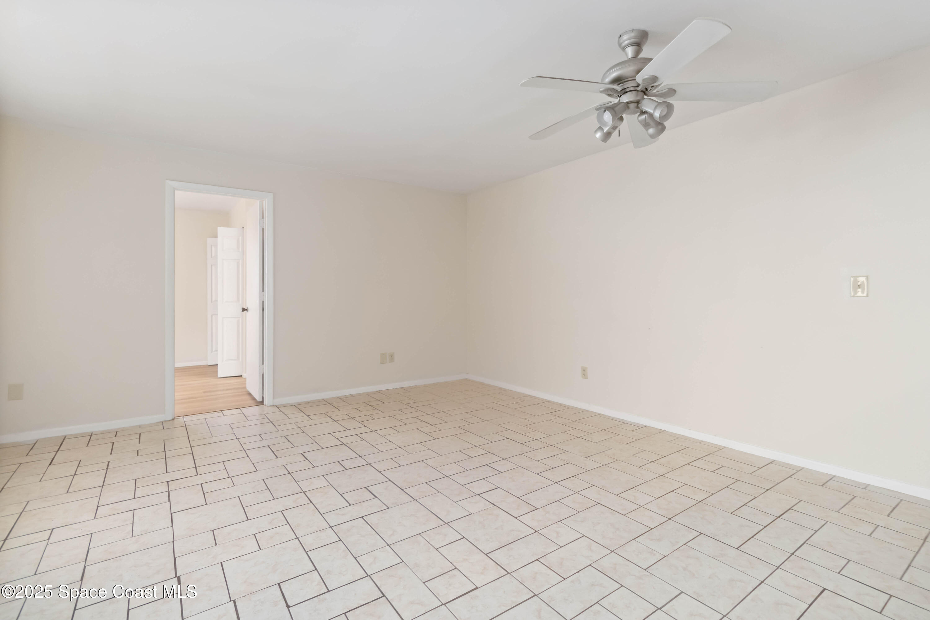 1480 Sheafe Avenue Northeast, Unit 103 Palm Bay, FL 32905 - Photo 12 of 31 wooden floor in a empty room