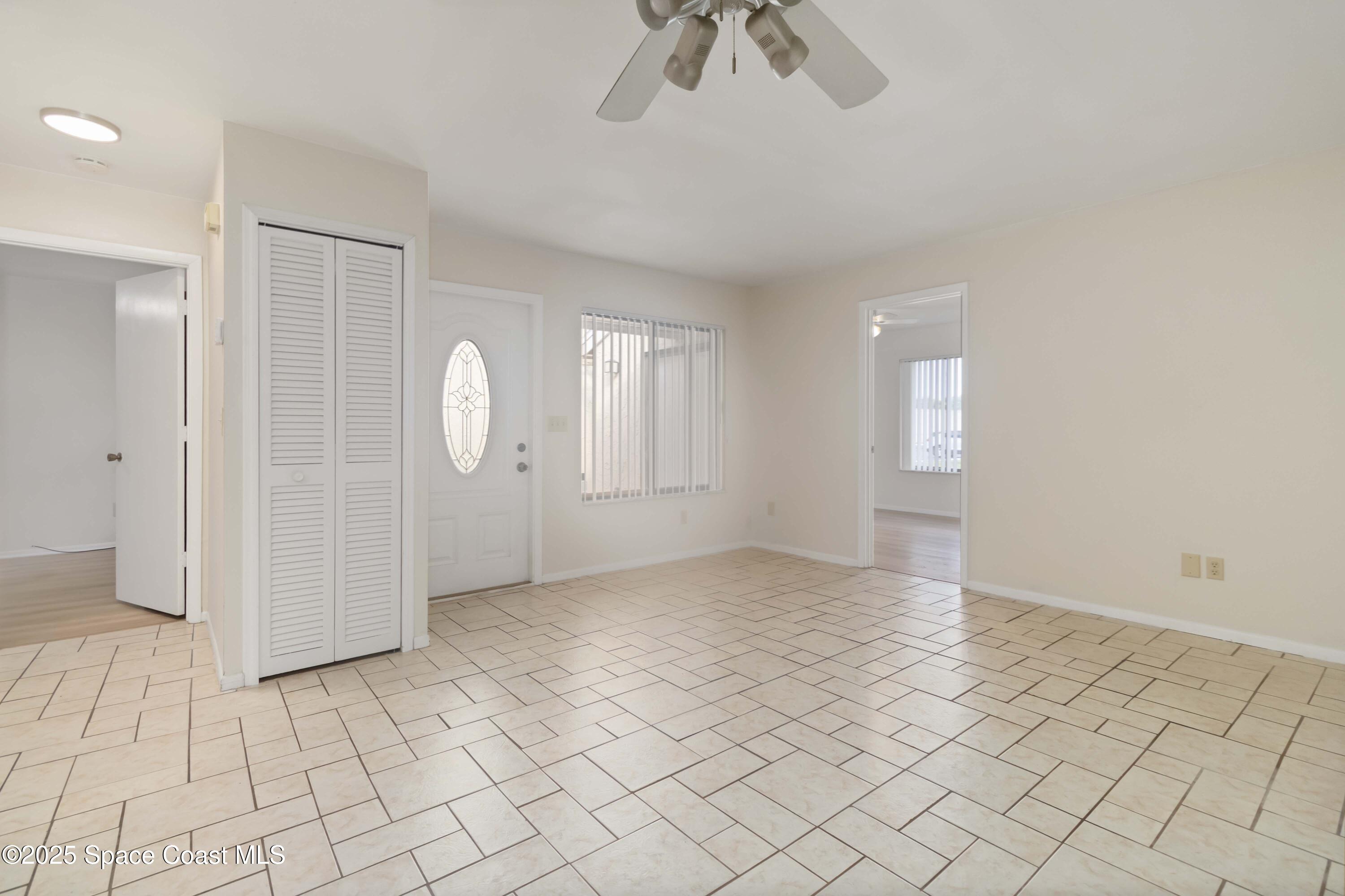 1480 Sheafe Avenue Northeast, Unit 103 Palm Bay, FL 32905 - Photo 13 of 31 an empty room with kitchen view