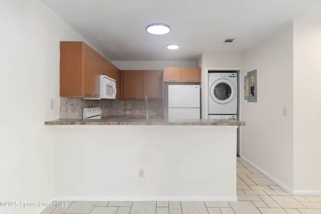 a kitchen with a sink a stove and microwave