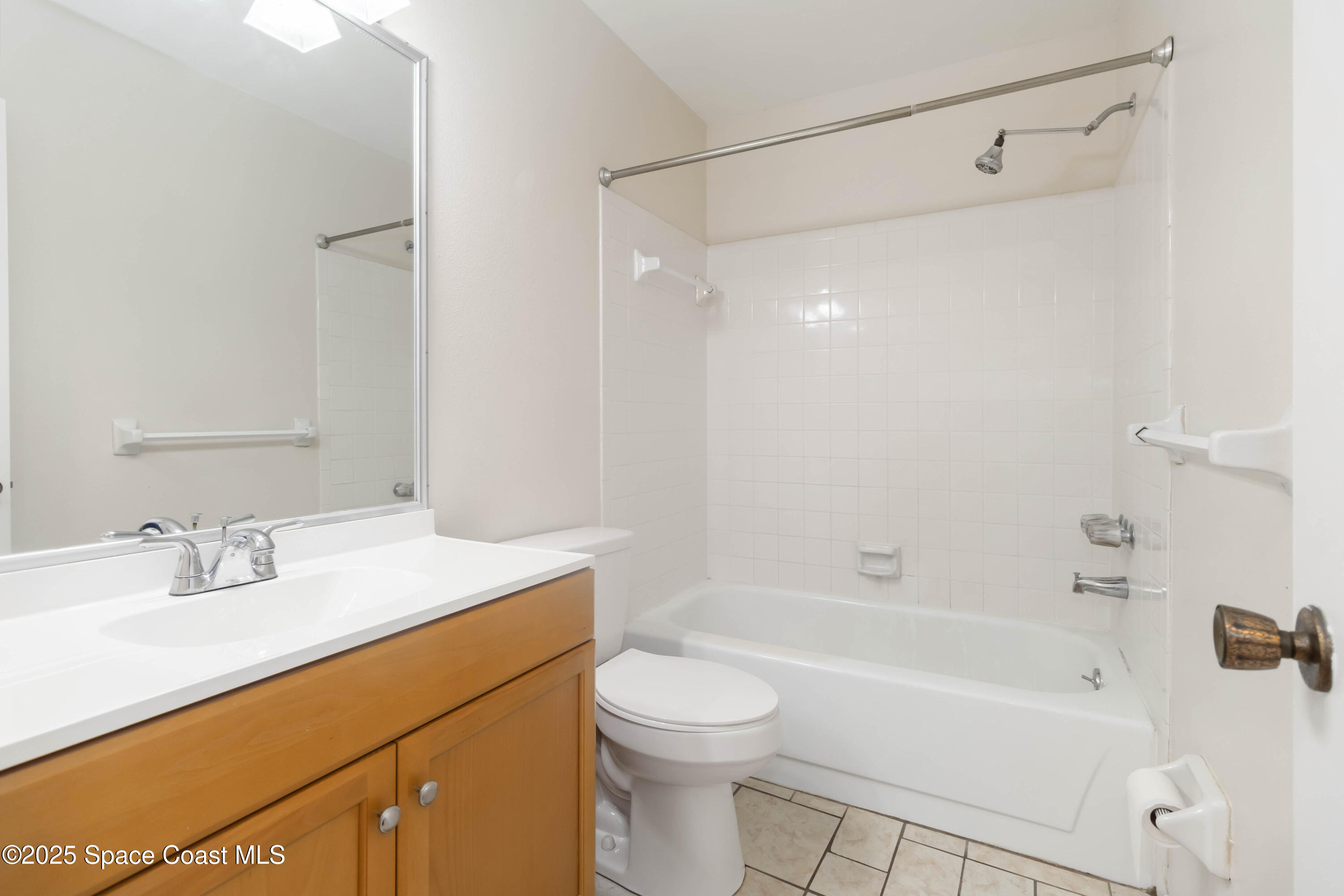 1480 Sheafe Avenue Northeast, Unit 103 Palm Bay, FL 32905 - Photo 20 of 31 a bathroom with a sink a toilet and a bathtub