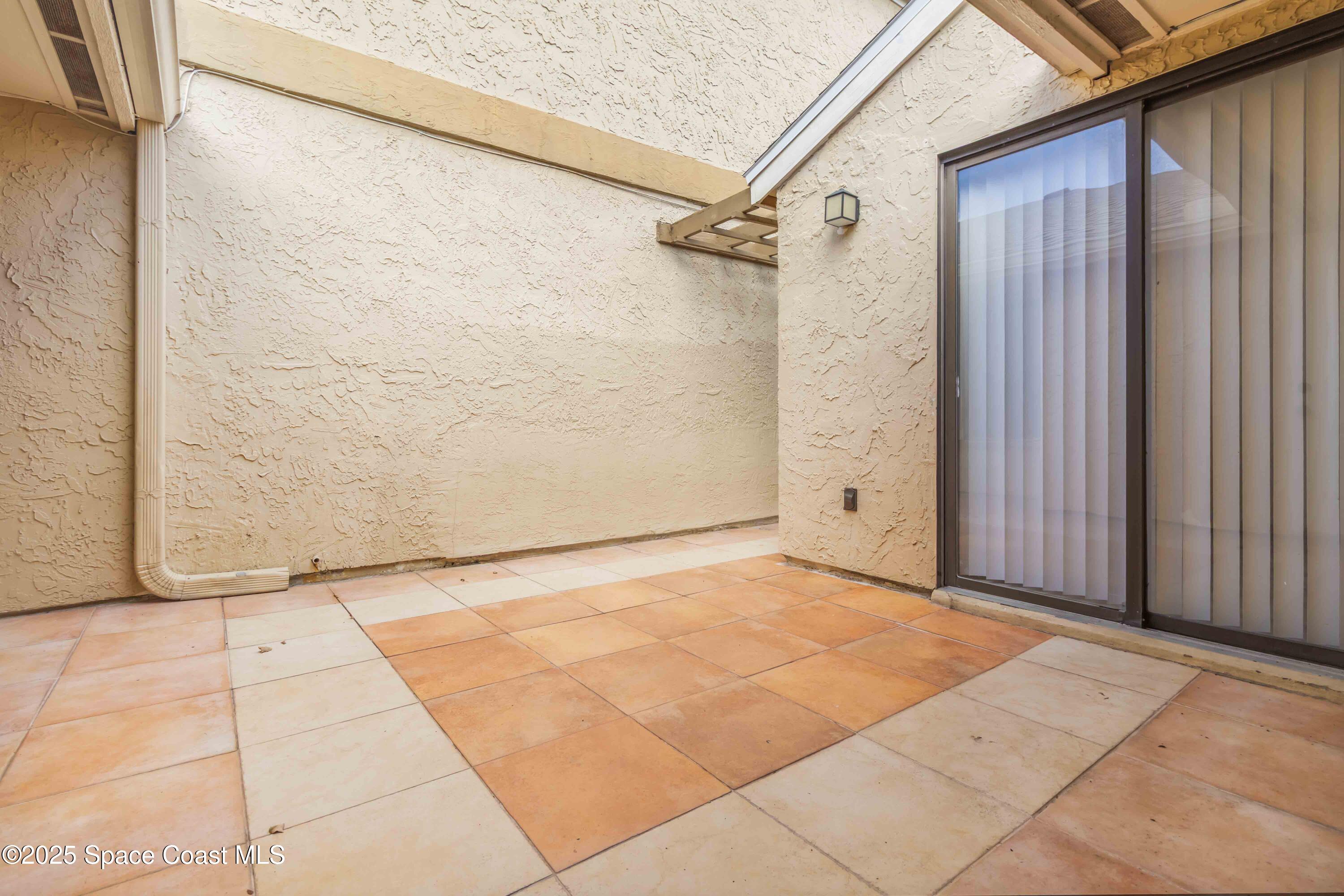 1480 Sheafe Avenue Northeast, Unit 103 Palm Bay, FL 32905 - Photo 6 of 31 a view of an empty room