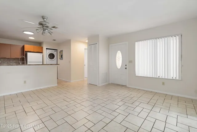 a view of a kitchen with granite countertop cabinets