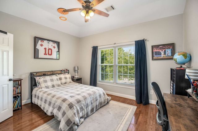 a bathroom with a double vanity sink mirror and shower