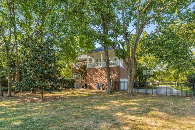 an aerial view of residential house with outdoor space and swimming pool