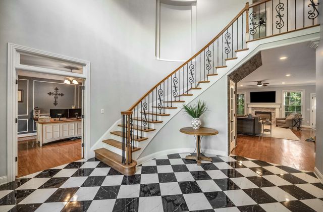 a view of entryway with wooden floor and a rug