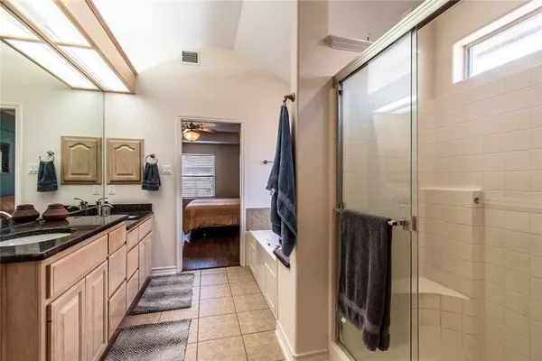 a hallway with a sink and cabinets
