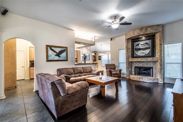 a living room with furniture and a fireplace