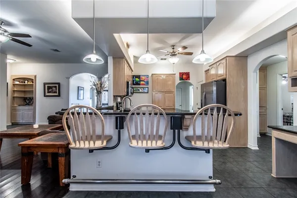 a view of hall way with furniture and chandelier