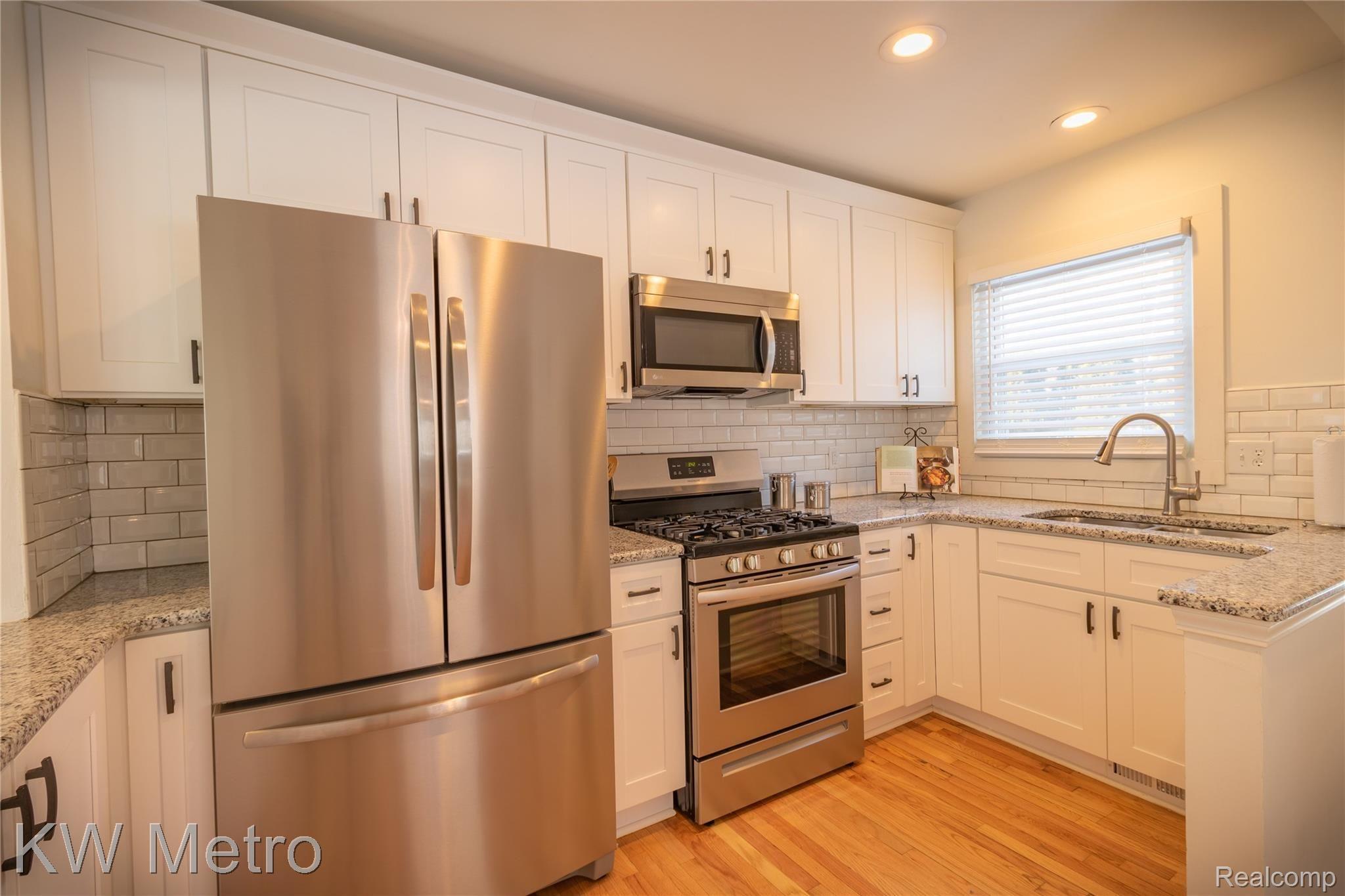 235 Eleanor Road Highland, MI 48356 - Photo 10 of 28 Granite Counters & Newer Stainless Steel Appliances