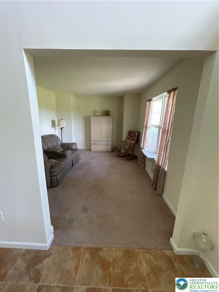 707 Gilbert Road Gilbert, PA 18331 - Photo 8 of 56 a view of a livingroom with furniture and a gate