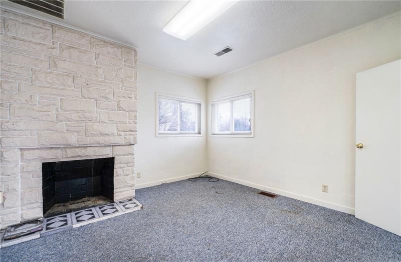 3030 Wilmington Road New Castle, PA 16105 - Photo 25 of 43 an empty room with windows and fireplace