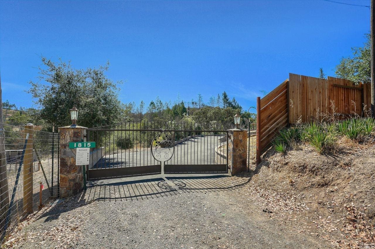 1815 Mark West Springs Road Santa Rosa, CA 95404 - Photo 1 of 1 a view of a backyard with wooden fence