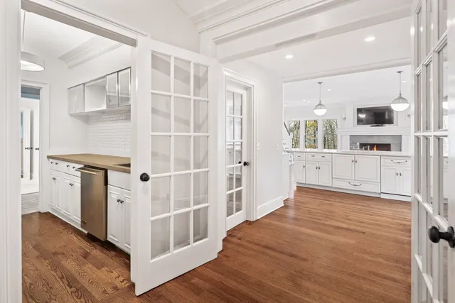 a view of a kitchen with wooden floor and a kitchen