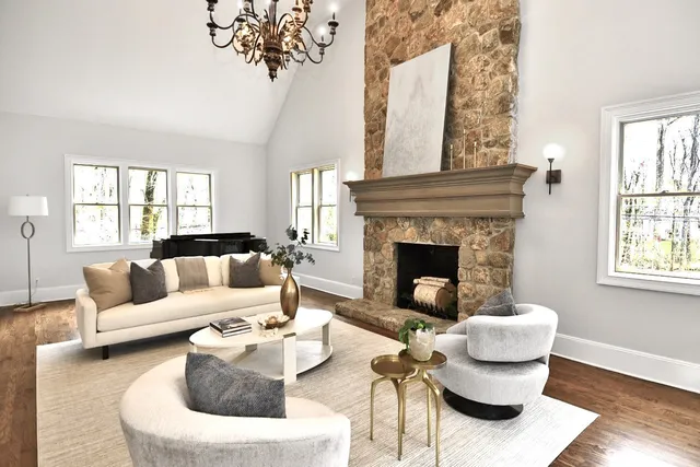 a living room with furniture and a fireplace