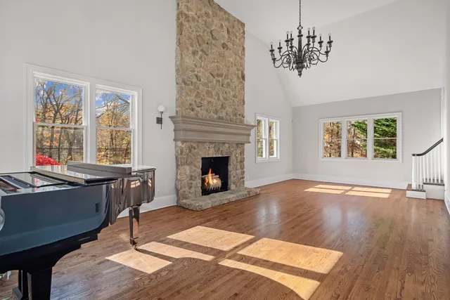 a living room with furniture a window and a fireplace