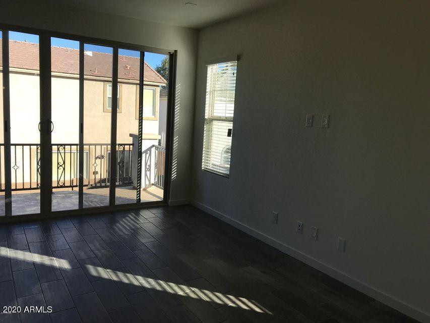 4038 East Erie Street, Unit 101 Gilbert, AZ 85295 - Photo 4 of 7 a view of front door with wooden floor
