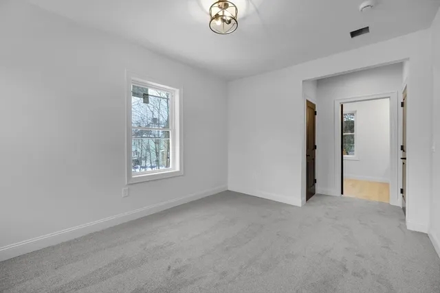a bathroom with a double vanity sink and mirror