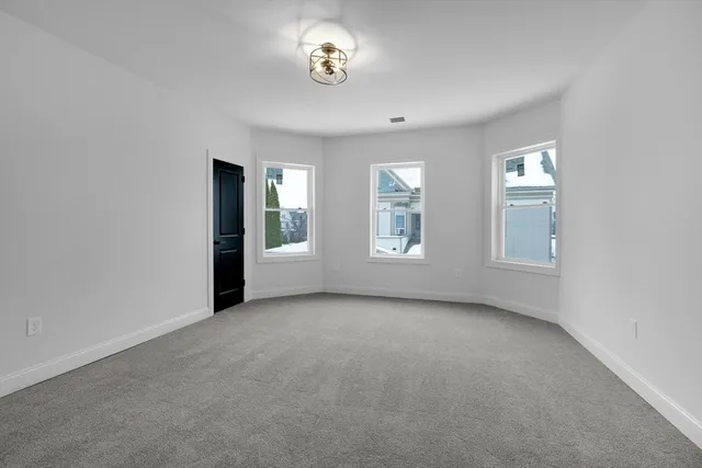 an empty room with a empty space and a window