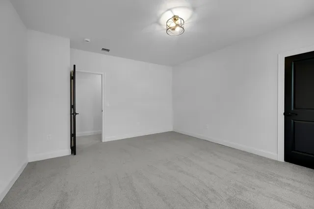 an empty room with a empty space and a window