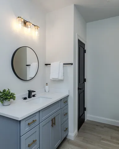 a bathroom with a sink and a mirror