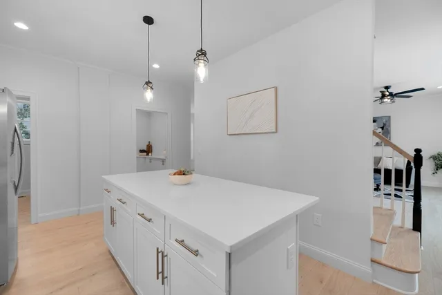 a bathroom with a sink a vanity and a mirror