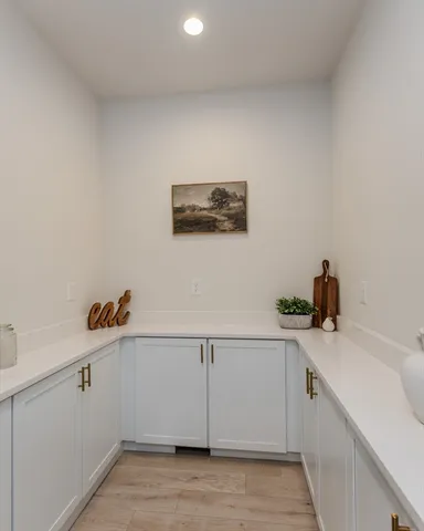 a view of cabinets and wooden floor